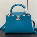 CAPUCINES MM 31 BLUE TAURILLON GOLD HARDWARE