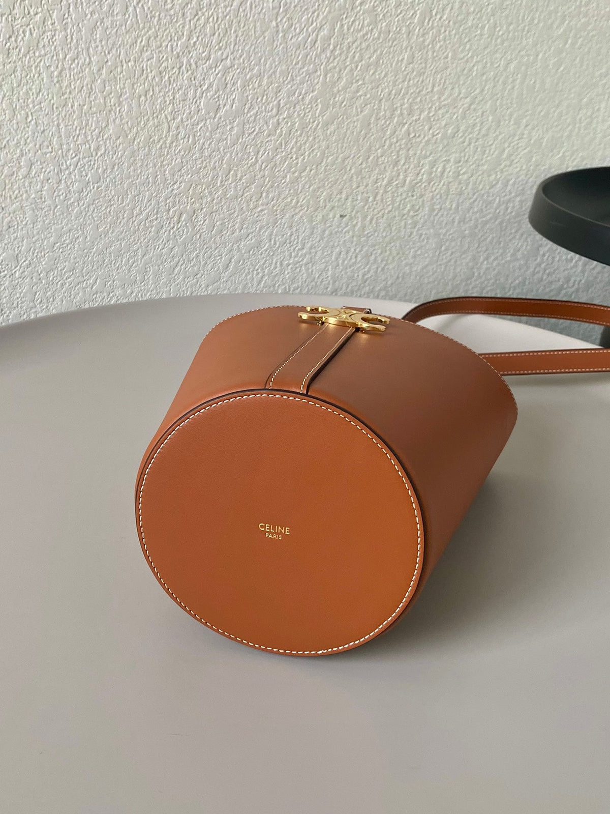 TRIOMPHE 25 BUCKET BAG CINNAMON BROWN CALFSKIN