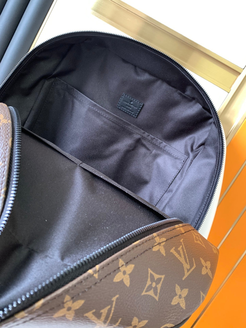 DEAN BACKPACK 42 IN BLACK AND BROWN MONOGRAM CANVAS