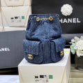 DRAWSTRING BUCKET BACKPACK 24 IN DARK BLUE DENIM GOLD HARDWARE